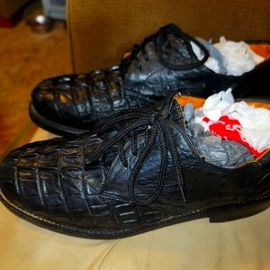 Elevate your style with these sleek Rudel loafers. Crafted from gator leather